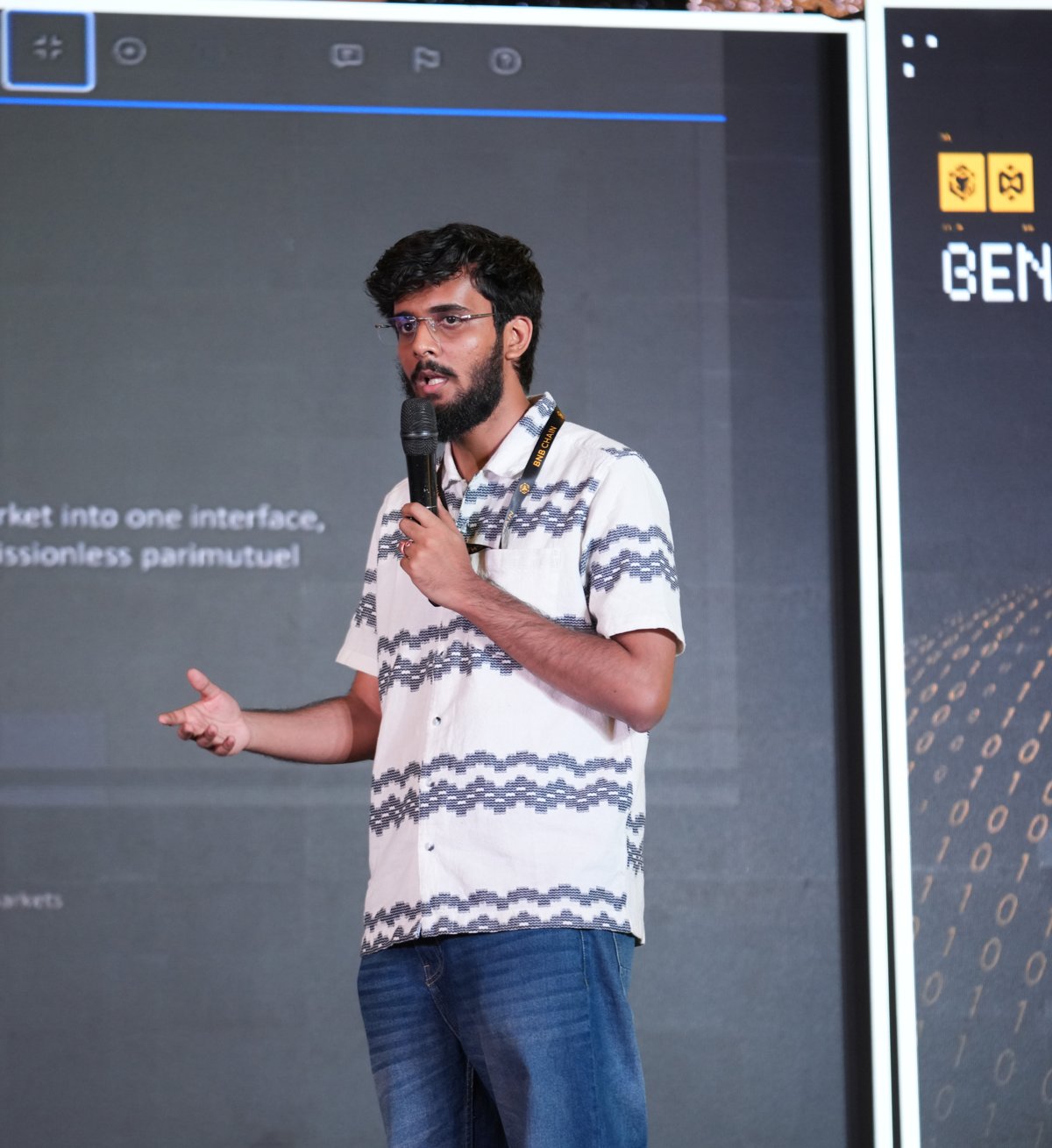 Husien Vora speaking on stage